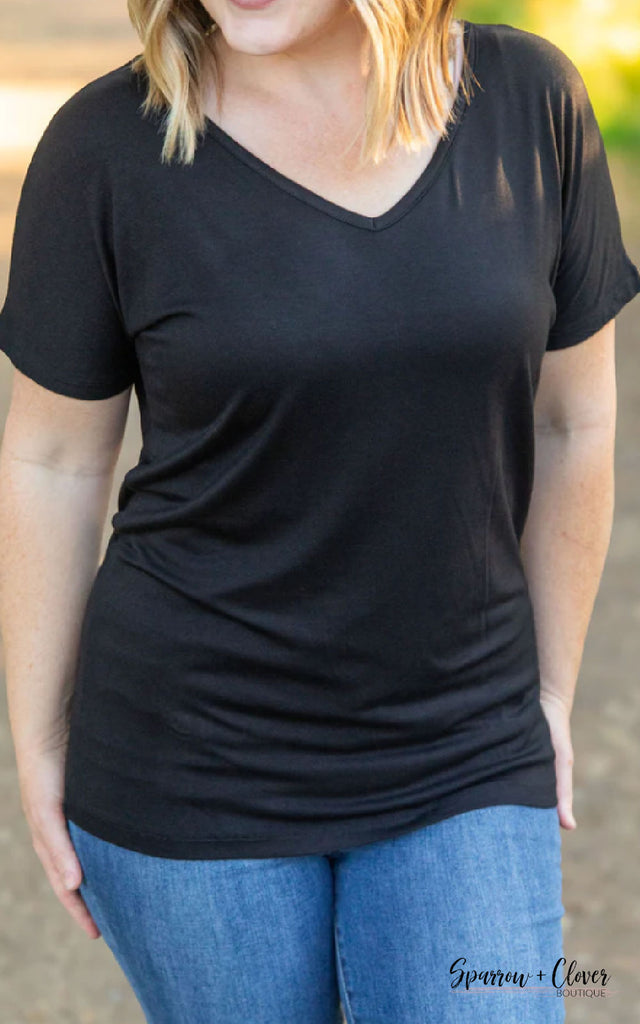 Women's black short sleeve shirt.