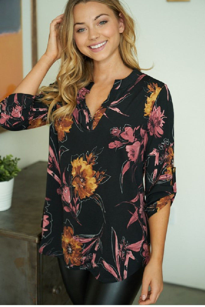 Women's 3/4 Sleeve Top that is black with a floral pattern. 