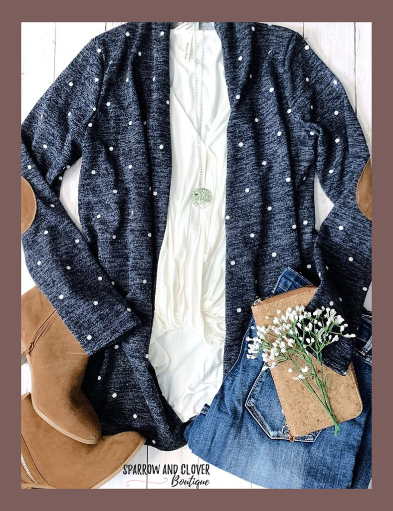 Women's polka dot cardigan with suede elbow patches.